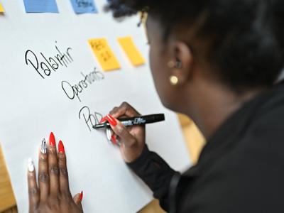 Palantiri writing on a board